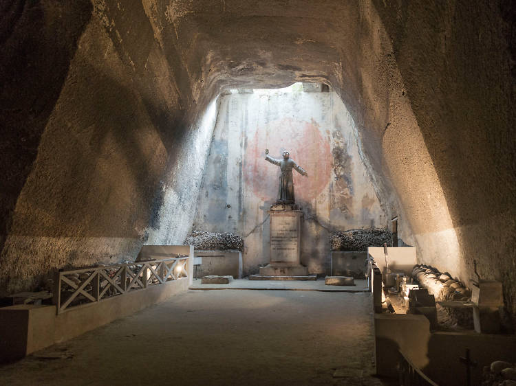 Explore an eerie underground cemetery in Naples